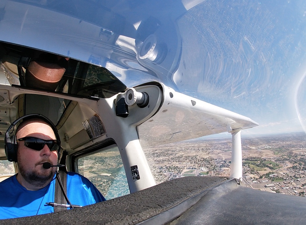 Matthew Cox, FAA Gold Seal CFI, in the cockpit of a Cessna 172.